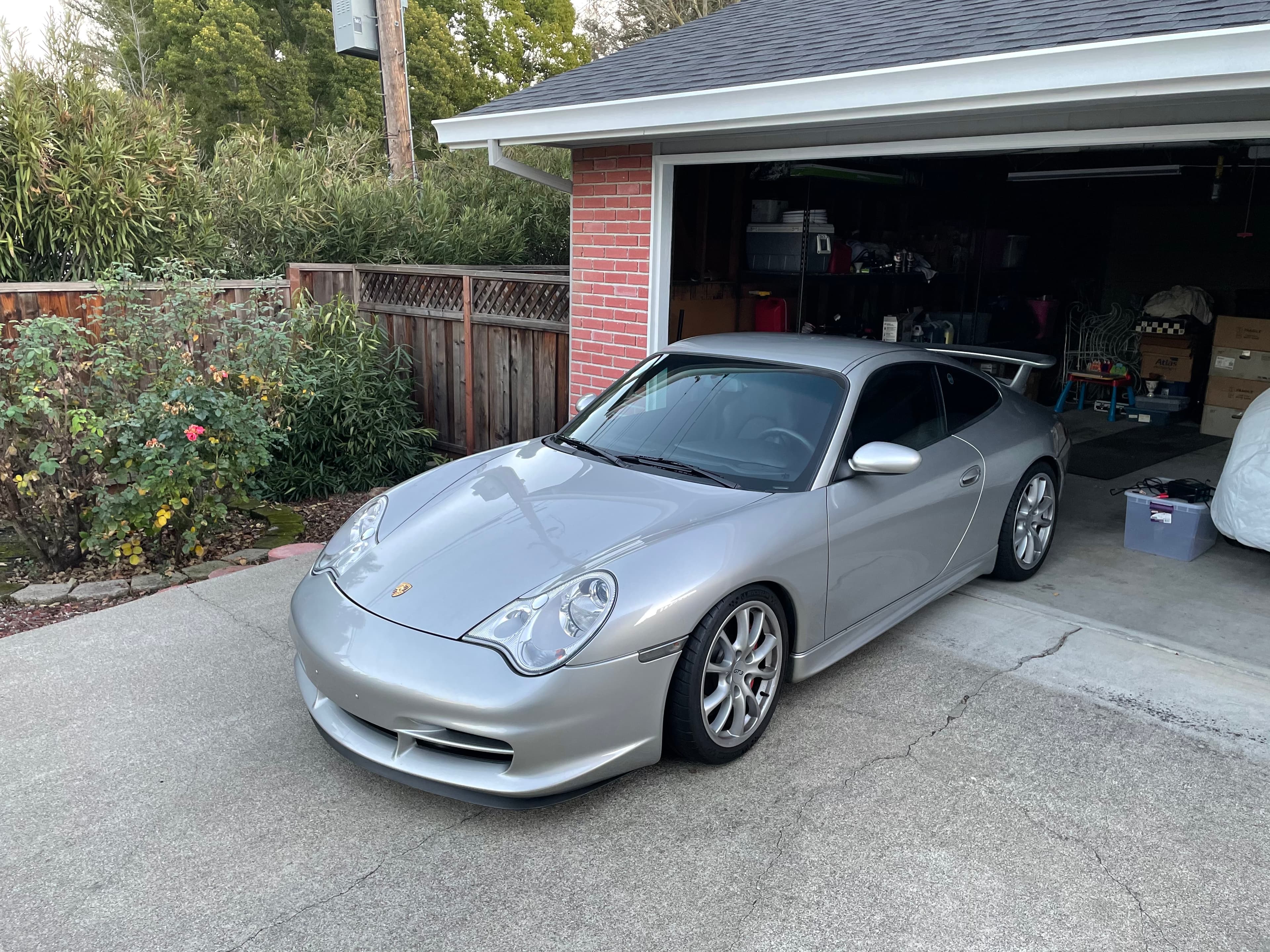 Matthew Herman’s silver 996.2 GT3, front three-quarter on a residential driveway