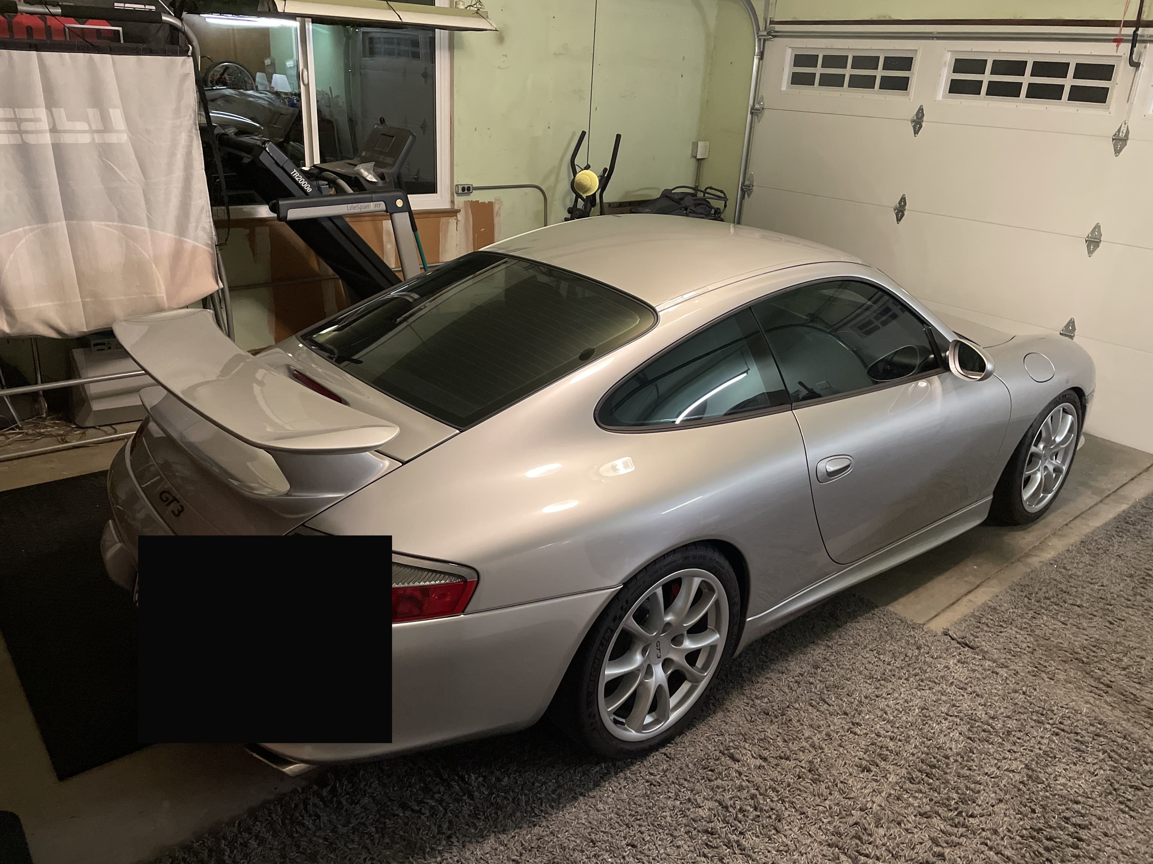 Matthew Herman’s silver 996.2 GT3 in the garage, rear three-quarter