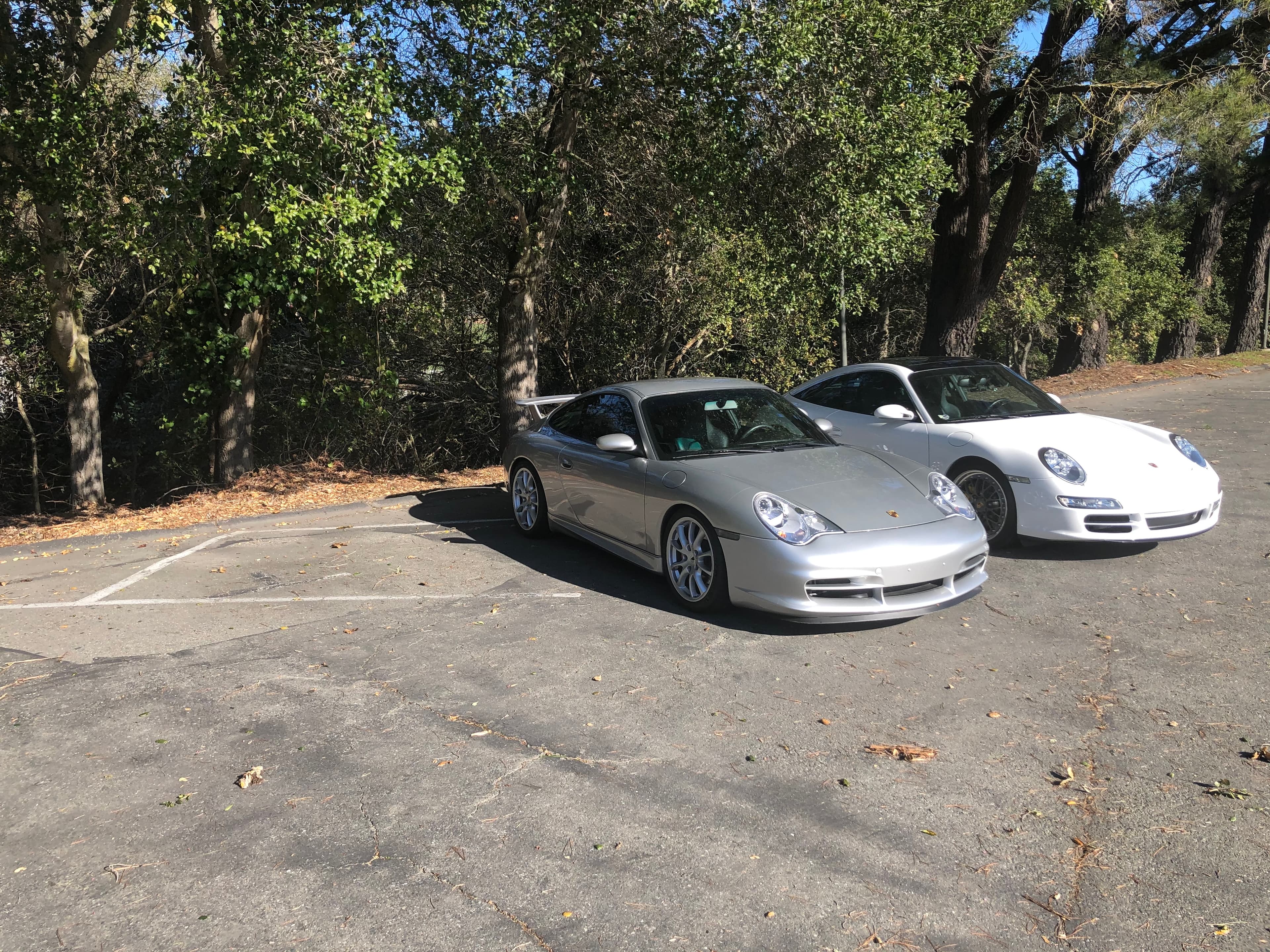 Matthew Herman’s silver 996.2 GT3 parked next to a white 997